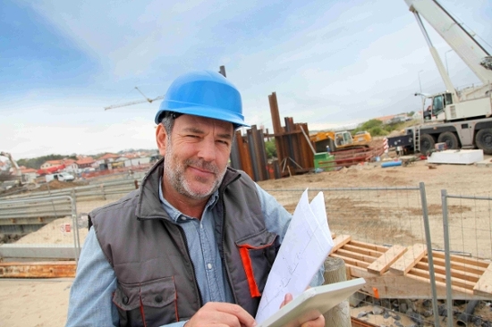 Contractor reviewing his tax documents and payroll